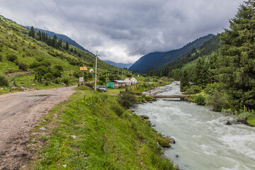 Fototapeta na wymiar Village in Karakol river valley in Kyrgyzstan