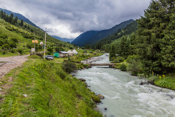 Fototapeta na wymiar Village in Karakol river valley in Kyrgyzstan