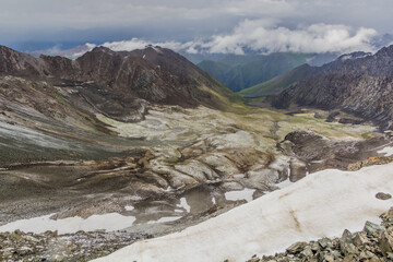 Fototapeta na wymiar Snow near Ala Kul pass in Kyrgyzstan