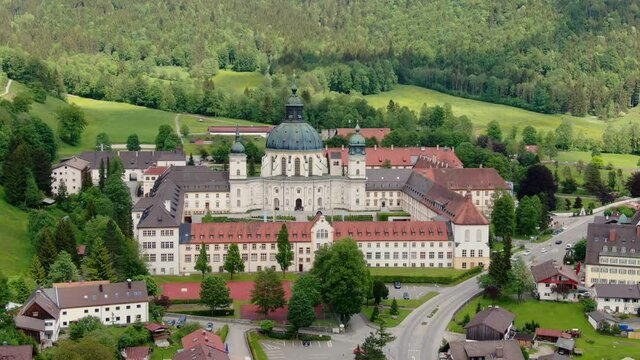 Ettal Abbey, called Kloster Ettal, a monastery in the village of Ettal, Bavaria, Germany - aerial photography