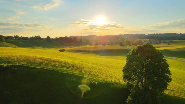 Amazing Sunset over farm fields in summer - aerial drone view