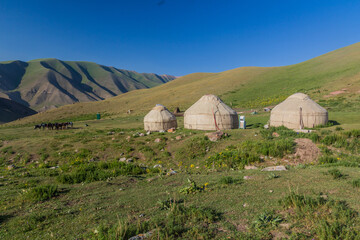 Fototapeta na wymiar Yurt camp in the mountains near Song Kul lake, Kyrgyzstan