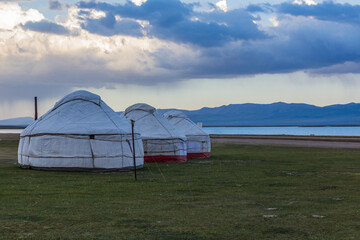Fototapeta na wymiar Yurt camp at the shores of Song Kul lake, Kyrgyzstan