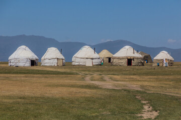 Fototapeta na wymiar Yurt camp at the shores of Son Kol Lake, Kyrgyzstan