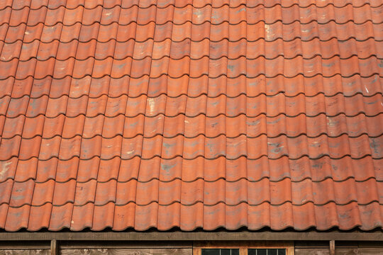 Old red tile roof fragment. Background image.