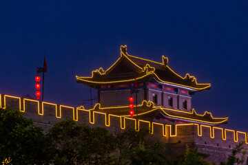 Fototapeta premium Evening view of illuminated city walls in Xi'an, China