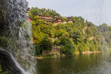 Fototapeta na wymiar Waterfall in Furong Zhen town, Hunan province, China