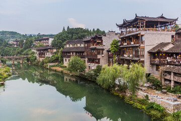 Fototapeta na wymiar Traditional houses and a river in Furong Zhen town, Hunan province, China