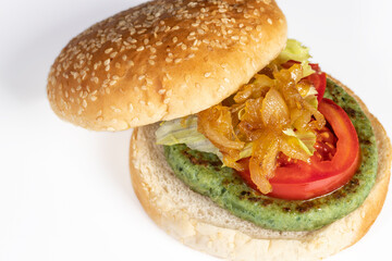 Vegan or vegetarian burger with spinach and potatoes. Healthy low calorie food, nutritious, with antioxidants, rich in folic acid and that improves intestinal transit. Ideal to take care of yourself