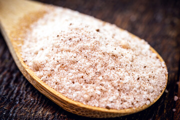 wooden spoon with refined sugar and powdered cinnamon. Typical ingredient of Brazilian cuisine.