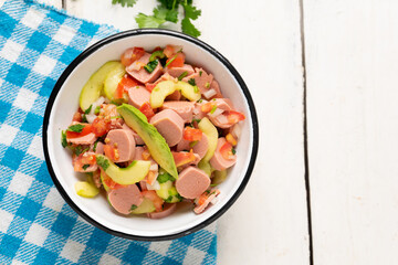 Mexican sausage ceviche with avocado on white background