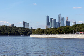 Naklejka premium Panoramic view of Moscow City from the ship that floats on the river, Russia