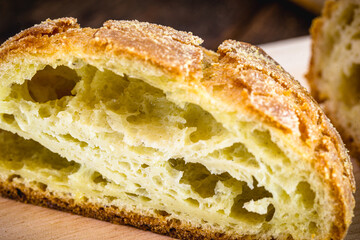 Brazilian bread, cut in half. Made with corn flour. Brazilian cuisine, minas gerais and são paulo state.