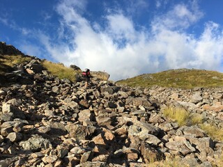 a man walk on rocky path way