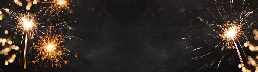 Silvester New Year 2025, New Year's Eve background banner panorama long- firework on rustic dark...