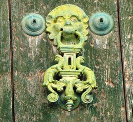 Ancient door	knocker (andean baroque, 17th century) on the door of San Pablo and San Pedro church...