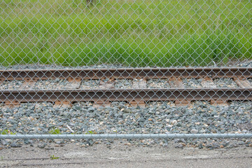 Chain Link Mesh Fence in front of Railway Track