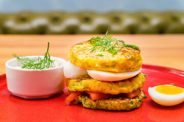 A stack of home-made pancakes with cheese and salmon