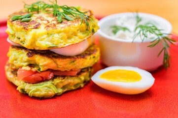 A stack of home-made pancakes with cheese and salmon