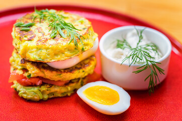 A stack of home-made pancakes with cheese and salmon