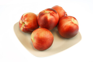 Plakat fresh white peaches in the plate isolated on white background