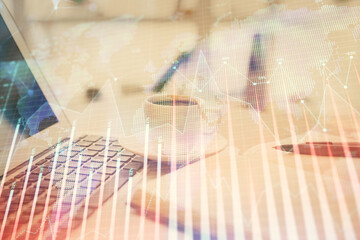 Double exposure of financial chart drawing and desktop with coffee and items on table background. Concept of forex market trading