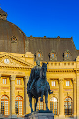 It's Carol statue and the Central University Library of Bucharest ( Biblioteca Centrala Universitara), a library in central Bucharest, Romania. - obrazy, fototapety, plakaty