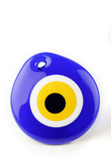 Glass Turkish eye “Nazar Boncugu” on the white background.