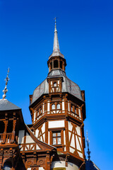 Obraz premium It's Tower of the Peles Castle, a Neo-Renaissance castle in the Carpathian Mountains of Romania