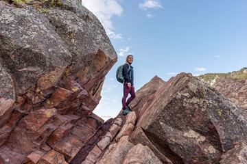 Female hiker standing on a rock formation, Boulder Flatiron © spatesphoto