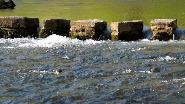 Close up view of stepping stones for crossing the river.