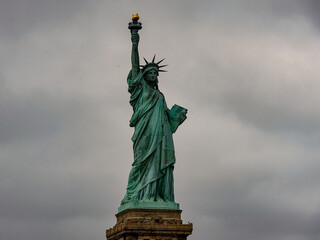 Obraz premium Statue of Liberty of New York on a cloudy day, NY, United Sates of America