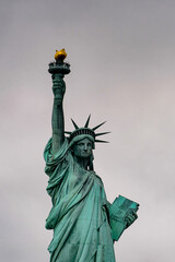 Fototapeta premium Statue of Liberty of New York on a cloudy day, NY, United Sates of America