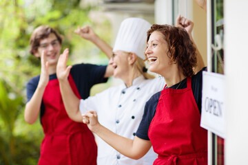 Café opening after lockdown. Open door sign.