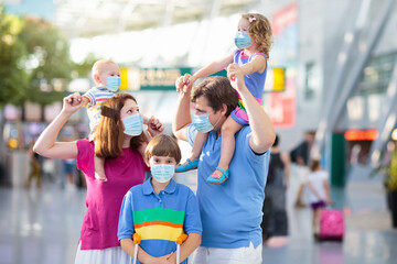 Family in airport in face mask. Virus outbreak.