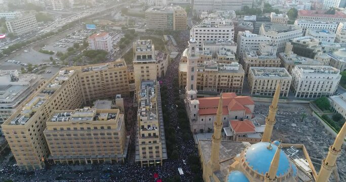 Beirut, Lebanon 2019 : day drone shot on road from Martyr square leading to Riad El Solh square with thousands of protesters revolting against government corruption during the Lebanese revolution