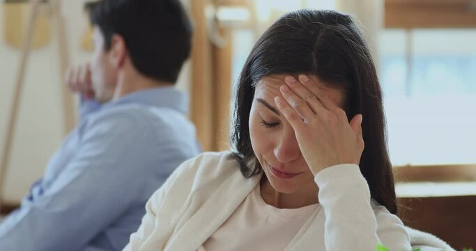 Head shot frustrated young mixed race woman feeling stressed after conflict with boyfriend. Depressed millennial wife having misunderstand family problems with husband, avoid talking after quarrel.