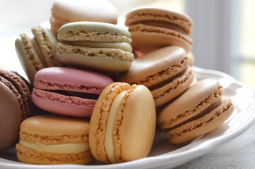Pastel macarons on a white plate