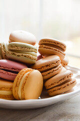 Pastel macarons on a white plate