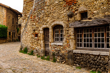 Fototapeta na wymiar Old stone house in Perouges, France, a medieval walled town, a popular touristic attraction.