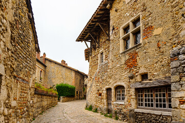 Fototapeta na wymiar Old stone house in Perouges, France, a medieval walled town, a popular touristic attraction.