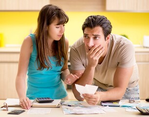 Fototapeta premium Young family struggling with personal finance