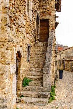 Old stone house in  Perouges, France, a medieval walled town, a popular touristic attraction.