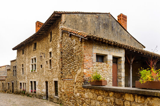 Old stone house in  Perouges, France, a medieval walled town, a popular touristic attraction.