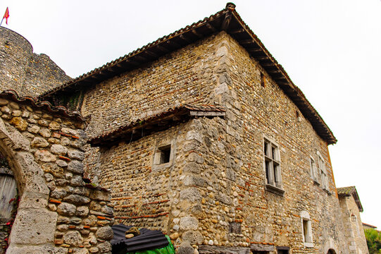 Old stone house in  Perouges, France, a medieval walled town, a popular touristic attraction.