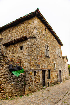 Old stone house in  Perouges, France, a medieval walled town, a popular touristic attraction.