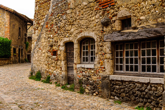Old stone house in  Perouges, France, a medieval walled town, a popular touristic attraction.