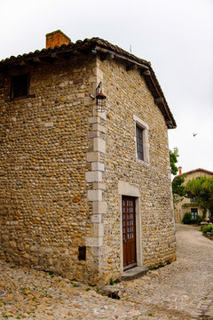 Narrow street in  Perouges, France, a medieval walled town, a popular touristic attraction.