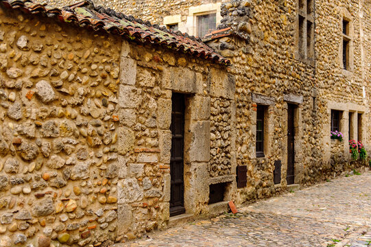 Narrow street in  Perouges, France, a medieval walled town, a popular touristic attraction.
