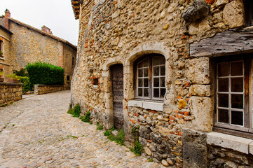Street of Perouges, France, a medieval walled town, a popular touristic attraction.